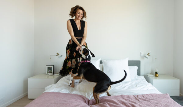 Erin Cebula and Pickles playing on a Lunazen Mattress